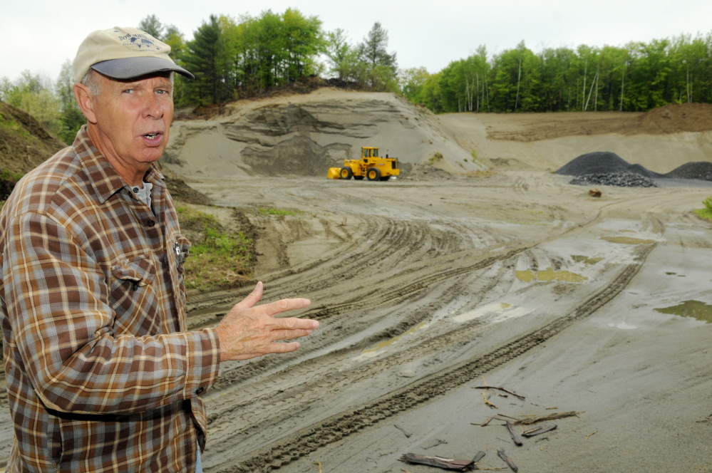 Ernie Rice, chairman of the Belgrade Board of Selectpersons, stands on May 19 at the proposed site of a new Town Office. The site is on Route 27 and is now a sand pit.