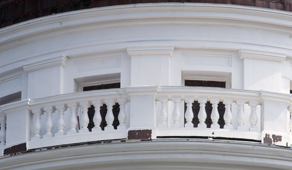 Peeling paint on the pillars around the State House dome in Augusta can be seen Wednesday.