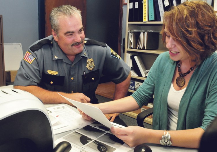 Skowhegan Police Deputy Chief Donald Bolduc speaks with Administrative Assistant Erin Brown on Thursday. Bolduc, who has been interim chief for the past month, will officially be named police chief Tuesday.
