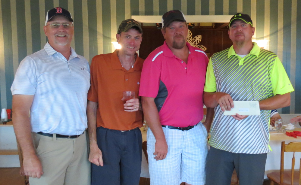 Men’s A Division— First place winners, from left, are Jeff Richards, Noel Dolbier, Larry Washington and Erin Washington.