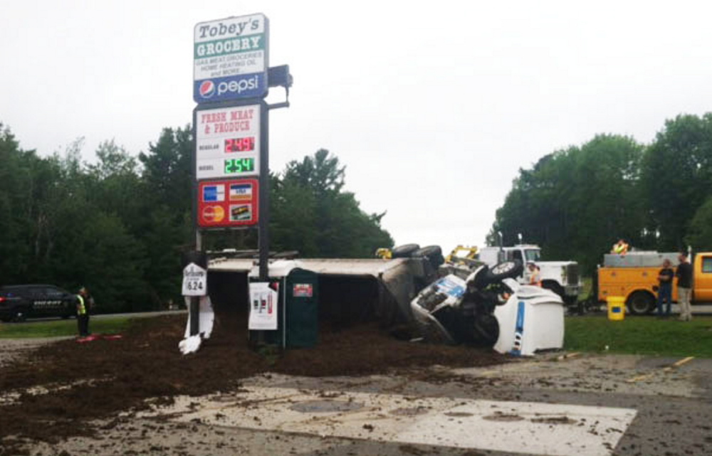 Jeremy Bamford, of Fayette, is expected to be charged with imprudent speed and failure to maintain control after his truck fully loaded with chicken manure tipped over, dumping the load in the parking lot of Tobey’s Grocery on Route 3 in South China on Friday.