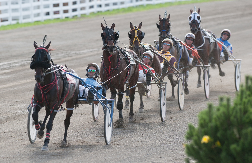 Kevin Bennett photo 
 The field of five horses cross the half mile marker during the Walter H. Hight Invitational on Saturday at the Skowhegan Fairgrounds. Heath Campbell riding Wheelaway won the race.