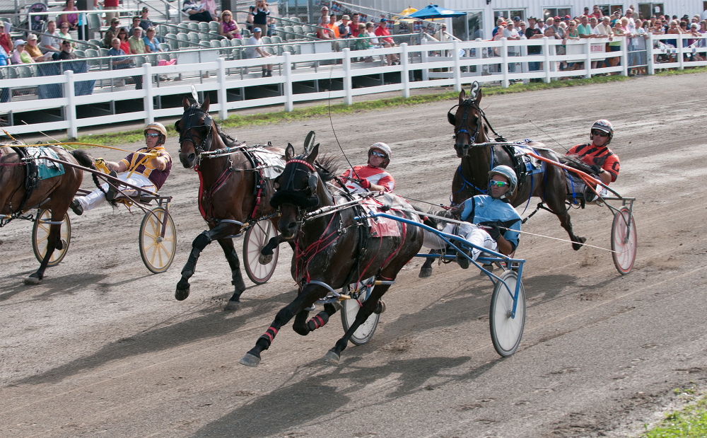 Kevin Bennett photo 
 Four of the five horses in the Walter H. Hight Invitational cross the start line on Saturday at the Skowhegan Fairgrounds. Heath Campbell riding Wheelaway won the race.