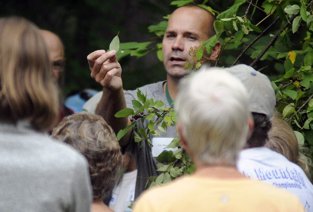 Ecologist Eric Doucette leads a tour at the Kennebec Land Trust annual meeting on Sunday in Fayette.