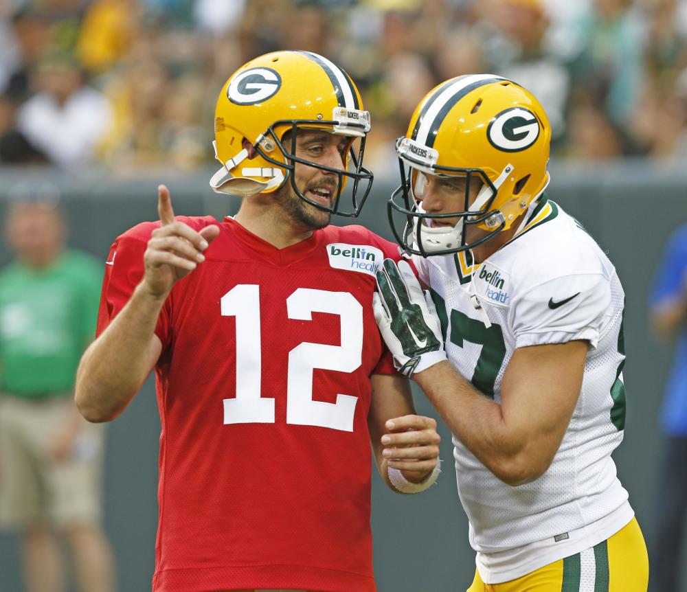 AP photo 
 In this Aug. 8 photo, Green Bay Packers quarterback Aaron Rodgers, left, and Jordy Nelson talk during training camp practice in Green Bay, Wis. Few receivers are as important to their teams as Nelson is to Aaron Rodgers and Green Bay. Nelson injured his left knee in a preseason game against the Pittsburgh Steelers on Sunday.