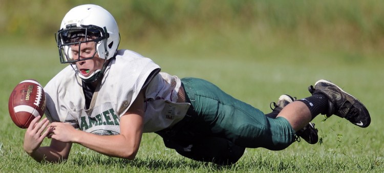 Staff photo by Andy Molloy 
 Winthrop High School's Antonio Meucci tries to pick off a pass during a scrimmage against Lincoln on Monday in Winthrop.