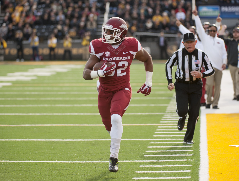 AP photo 
 In this Nov. 28, 2014, file photo, Arkansas running back Jonathan Williams runs alone down the sideline as he scores on a 23-yard reception during the first quarter of a game against Missouri in Columbia, Mo. The 18th-ranked Razorbacks lost half their dynamic duo at running back when Williams injured his left foot during an Aug. 15 scrimmage.