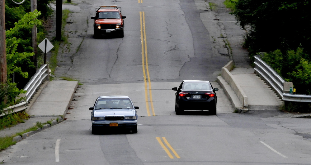 Traffic passes over the bridge on Gilman Street in Waterville on Tuesday. The bridge will be rededicated Thayer Memorial Bridge in a ceremony Sept. 12.