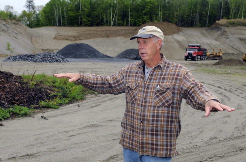 Chairman of the Belgrade Board of Selectpersons Ernie Rice, standing in May on the site where town officials propose to build a new Town office, discusses the construction plan.