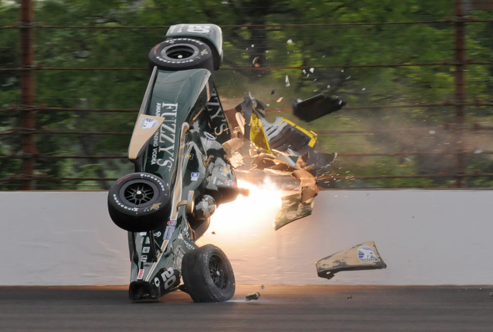 In this May 17 file photo, Ed Carpenter hits the wall in the second turn during practice before qualifications for the Indianapolis 500 at Indianapolis Motor Speedway. The IndyCar Series has bounced from one problem to another all season as it scrambles for viewers and new fans. It heads into the season finale this weekend after suffering the worst possible blow: The death of a driver, with Justin Wilson dead at 37 from injuries suffered in a crash.
