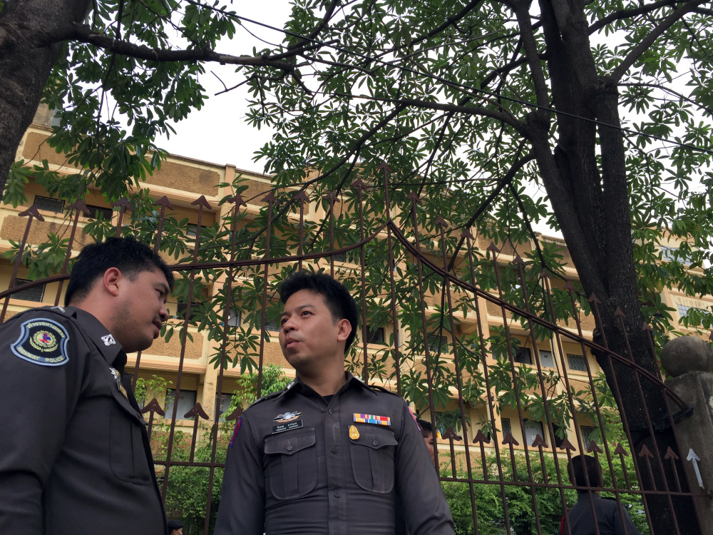 The Associated Press Thai police stand outside an apartment building in Nong Jok on the outskirts of Bangkok on Saturday. Thai police say they arrested a suspect in the blast at the Erawan Shrine on Aug. 17 in this apartment building on Saturday.