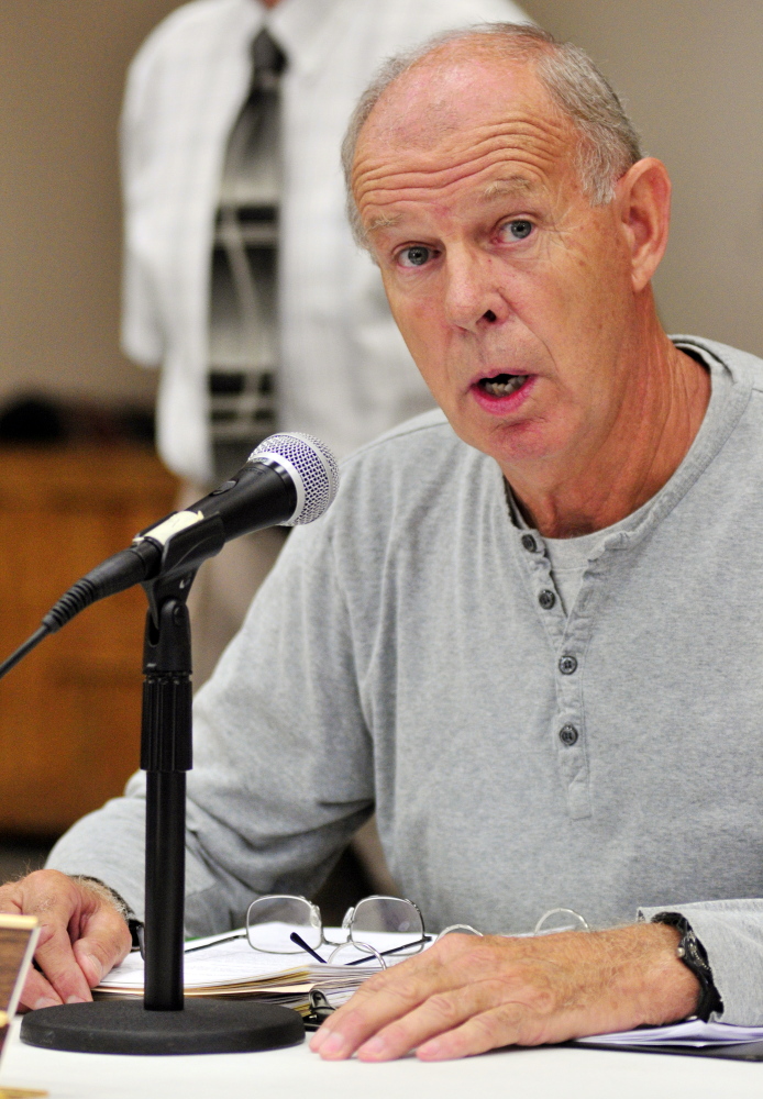 Board of Selectpersons Chairman Ernie Rice answers a question Saturday during a special town meeting about building a Town Office. The meeting was held in the Belgrade Community Center for All Seasons.