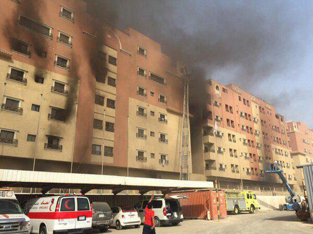 Smoke billows from a residential complex in Khobar, Saudi Arabia, on Sunday. A fire broke out at the residential complex used by the state oil giant Saudi Aramco.