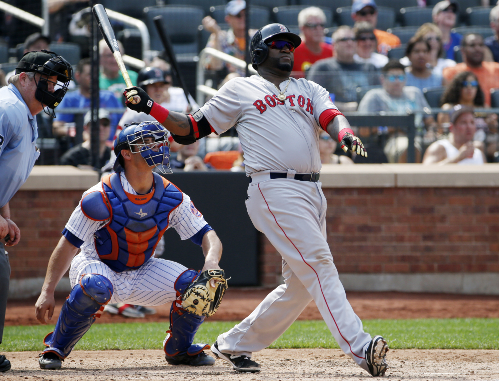New York Mets catcher Anthony Recker, center, watches as Boston Red Sox's David Ortiz, right, hits a sixth-inning two-run home run in an interleague baseball game in New York, Sunday, Aug. 30, 2015. (AP Photo/Kathy Willens)