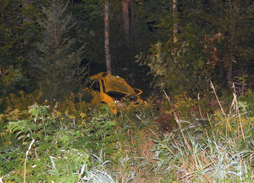 A Ford Focus driven by Johnathan Daellenbach, of Reading, Massachusetts, is seen in the field where it came to rest after crashing into a stone walls and trees on Route 27 in New Vineyard Sunday night. Daellenbach died of his injuries.