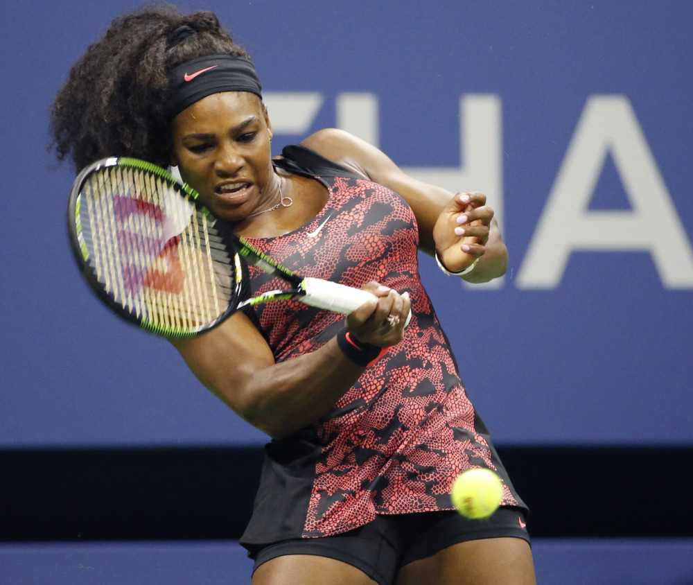 U.S. Open defending champion Serena Williamsreturns a ball during her first round match against Vitalia Diatchenko on Monday in New York. Williams won 6-2, 2-0 after Diatchenko pulled out of the match with an injury.