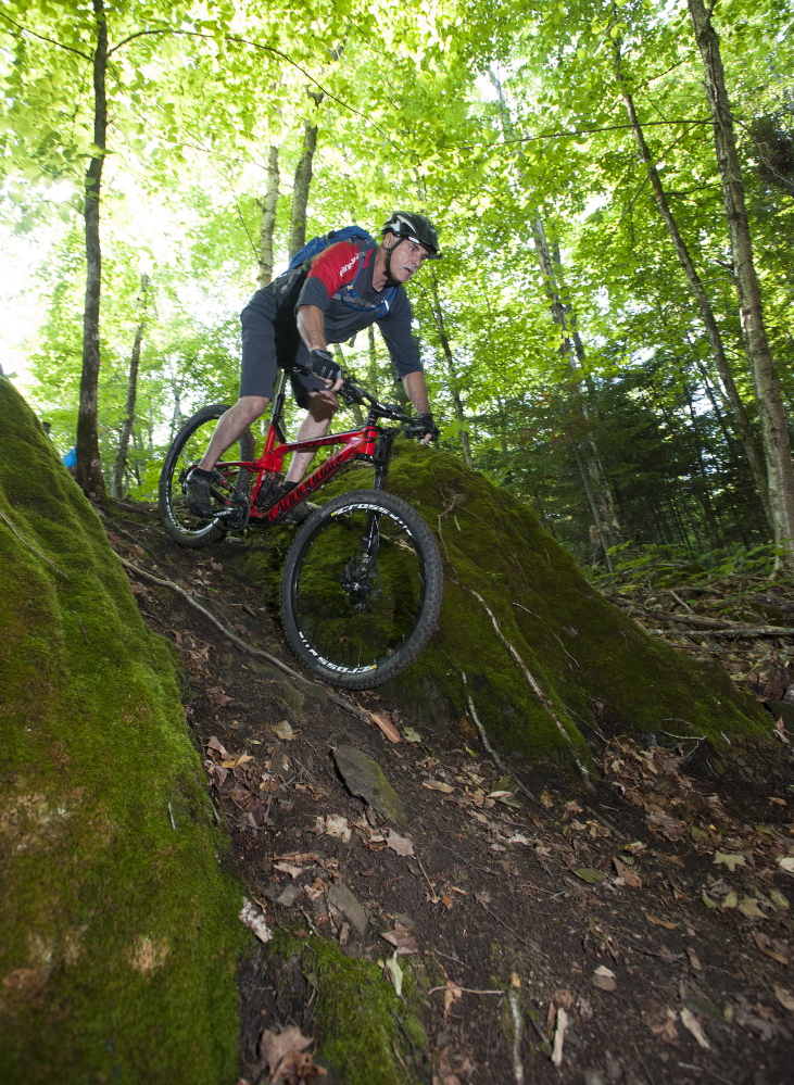 Tom Chasse of Presque Isle bikes in the area known as Gravity Rock at the Nordic Heritage Center, which hopes to become a biking “destination” despite Presque Isle’s remote location.