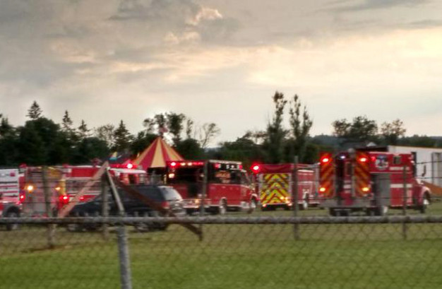 Officers surround the scene of a tent collapse in Lancaster, N.H., on Monday evening. Authorities say the circus tent collapsed when a severe storm hit the fairground.