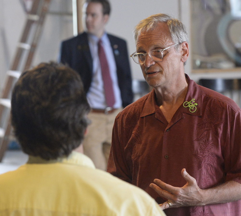 U.S. Rep. Earl Blumenauer, D-Ore., meets with individuals after speaking about marijuana at the Urban Farm Fermentory in Portland on Thursday.