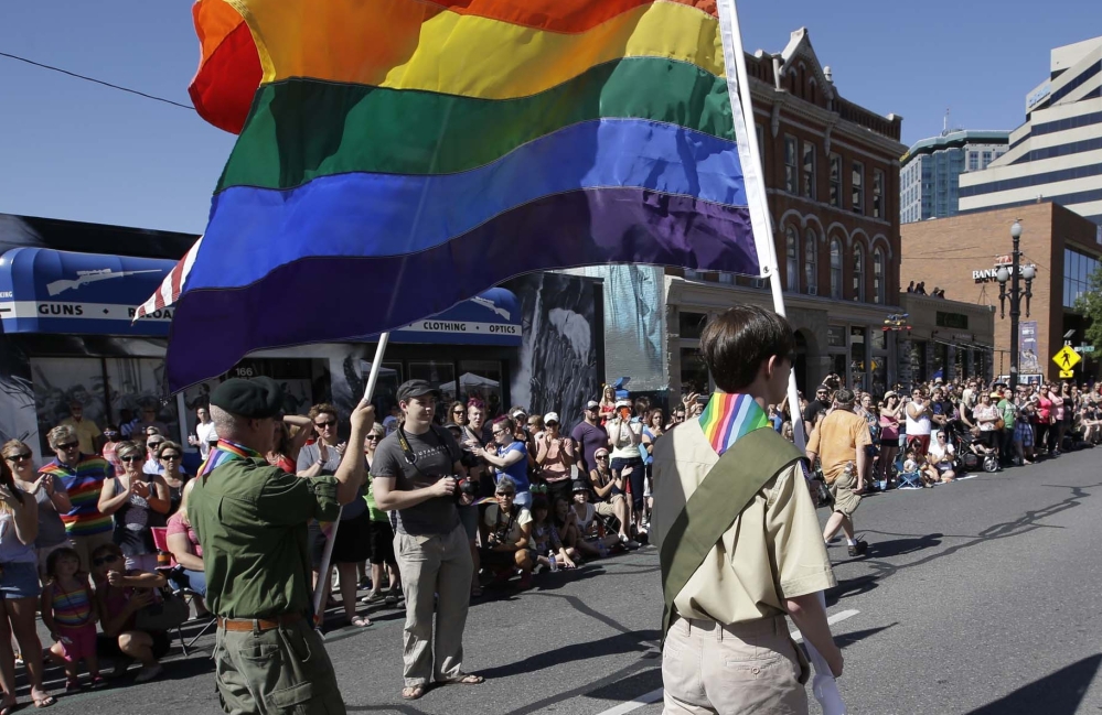 Boy Scouts march during Salt Lake City’s gay pride parade in 2014. Mormons make up 20 percent of all Boy Scouts, and the spiritual life of Mormon boys is deeply woven with scouting.