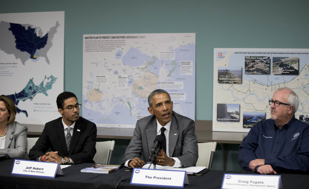 President Obama participates in a roundtable on Hurricane Katrina at the Andrew P. Sanchez Community Center in New Orleans, Thursday, Aug. 27, 2015, while visiting for the 10th anniversary since the devastation of Hurricane Katrina. The roundtable highlighted  advancements in national preparedness, showcase Gulf Coast resiliency, mark the achievements of the New Orleans community over the past 10 years with opportunities to build future resilience.(AP Photo/Andrew Harnik)