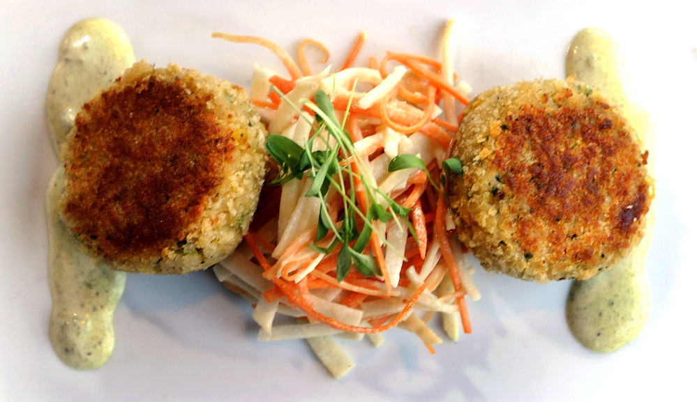 Maine crab cakes with slaw of jicama, carrot and poblano cream.