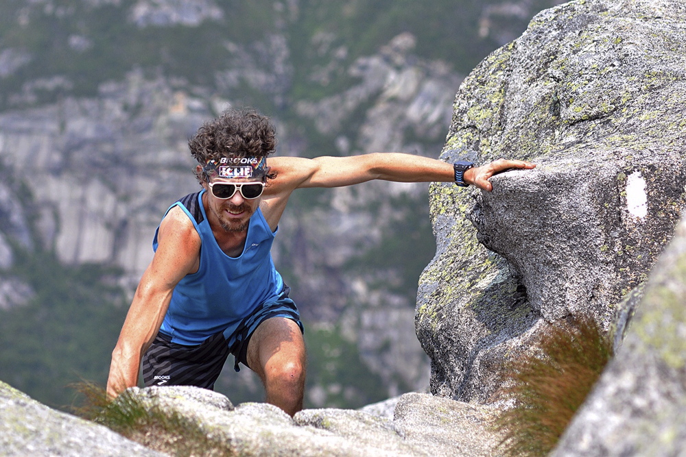 Scott Jurek of Boulder, Colo., climbs to the summit of Mount Katahdin on July 12. Luis Escobar/Brooks Running Co. via The Associated Press