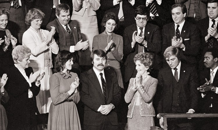 In this Jan. 27, 1982, photo, Lennie Skutnik, center front,  the man who jumped into the Potomac River and saved one of the passengers aboard the Air Florida jetliner that crashed on Jan. 13, receives applause from first lady Nancy Reagan and other dignitaries in Capitol Hall in Washington. The applause came when President Ronald Reagan made mention of the event while making his State of the Union address to a joint session of Congress. The Associated Press