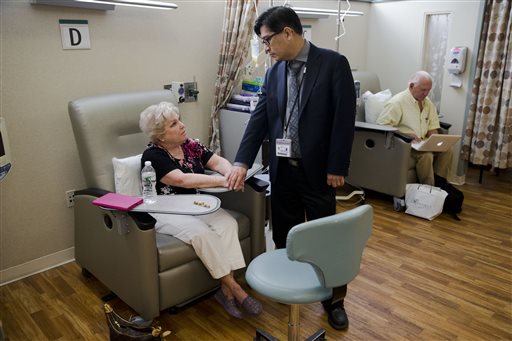 Judith Bernstein meets with Dr. Henry Fung at the Fox Chase Cancer Center in Philadelphia on Aug. 4,. Her husband, Arnold, is at right. Bernstein has had eight different types of cancer over the last two decades, all treated successfully. The Associated Press