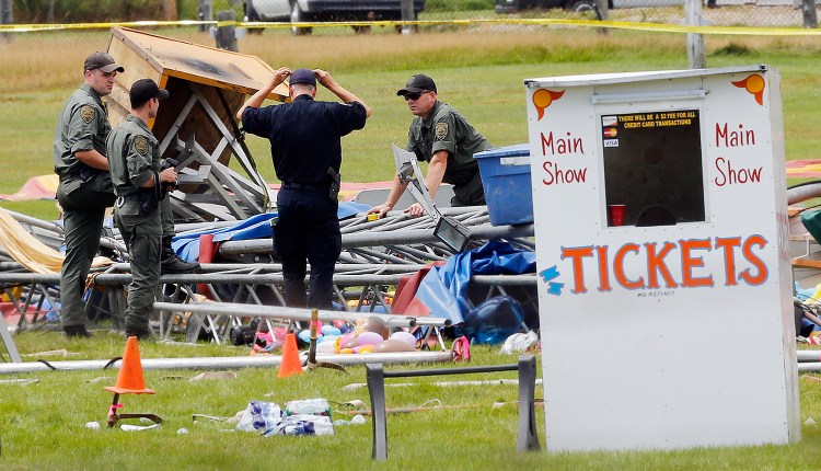 Investigators are at the scene of a circus tent that collapsed, killing a father and his 6-year-old daughter in Lancaster, N.H.  in this Aug. 4 file photo. Since the accident, questions have been asked about how the circus operator could have prepared for, then put on a show in the middle of the town's fairgrounds without getting a permit or having the giant canopy inspected. The Associated Press