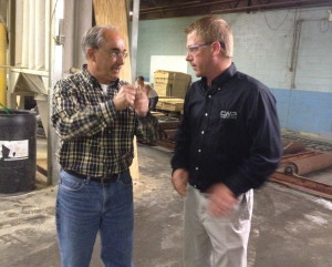 U.S. Rep. Bruce Poliquin, a Republican from Maine’s 2nd District, left, speaks with Brody Cousineau, vice president of Cousineau Wood Products, during a Tuesday tour of the company’s North Anson facility. (Staff photo by Michael Shepherd)