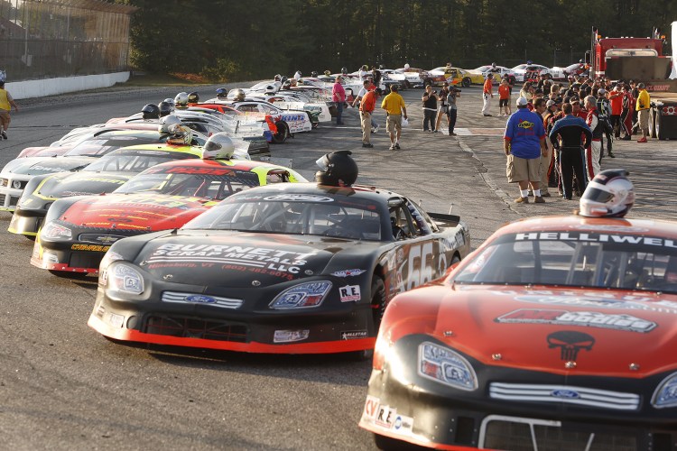 Qualifying racers are lined up before the start of the Oxford 250 Sunday. Carl D. Walsh/Staff Photographer