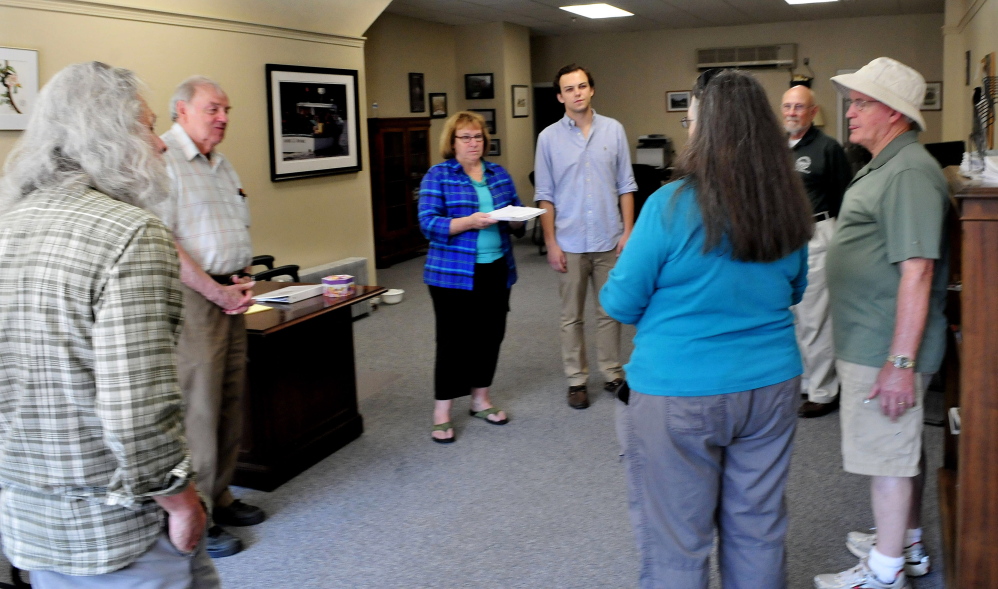 Staff photo by David Leaming
Larkin Domench, center, of MoveOn, delivered paperwork on behalf of the organization in support of the recent Iran nuclear deal to Pam Trinward, left, a representative of U.S. Rep. Chellie Pingree, D-1st District, at her office in Waterville on Tuesday. From left are Jim Mello, Elery Keene, Trinward, Domench, Chris Rusnov, State Rep. Tom Longstaff, D-Waterville, and Scott Dow.