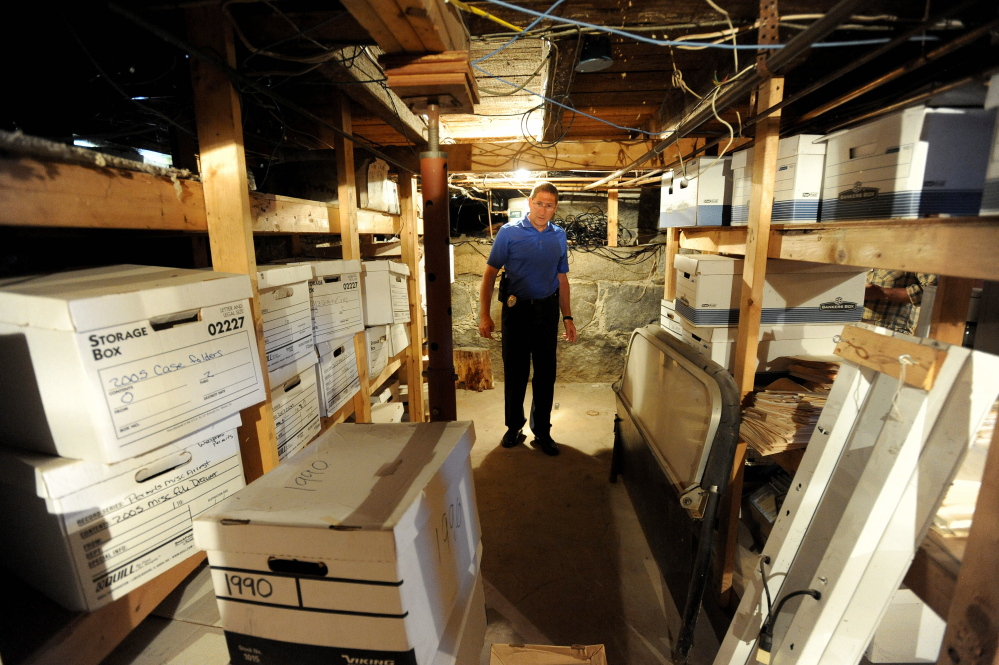 Michael Tracy, Oakland’s police chief, stands on July 9 in the basement of the police station, where documents are stored. Inadequate storage is one reason the town is proposing to replace the station with a $1.05 million building.