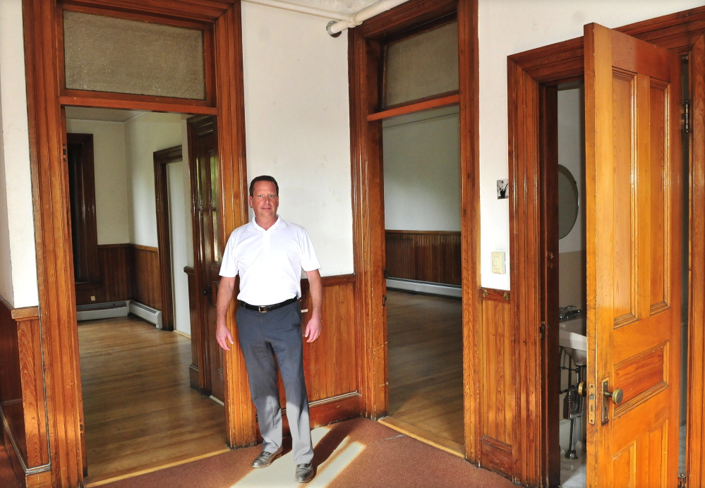 Bill Mitchell stands on the second floor of the Masonic building on Common Street in Waterville that he recently bought and plans to renovate and lease.