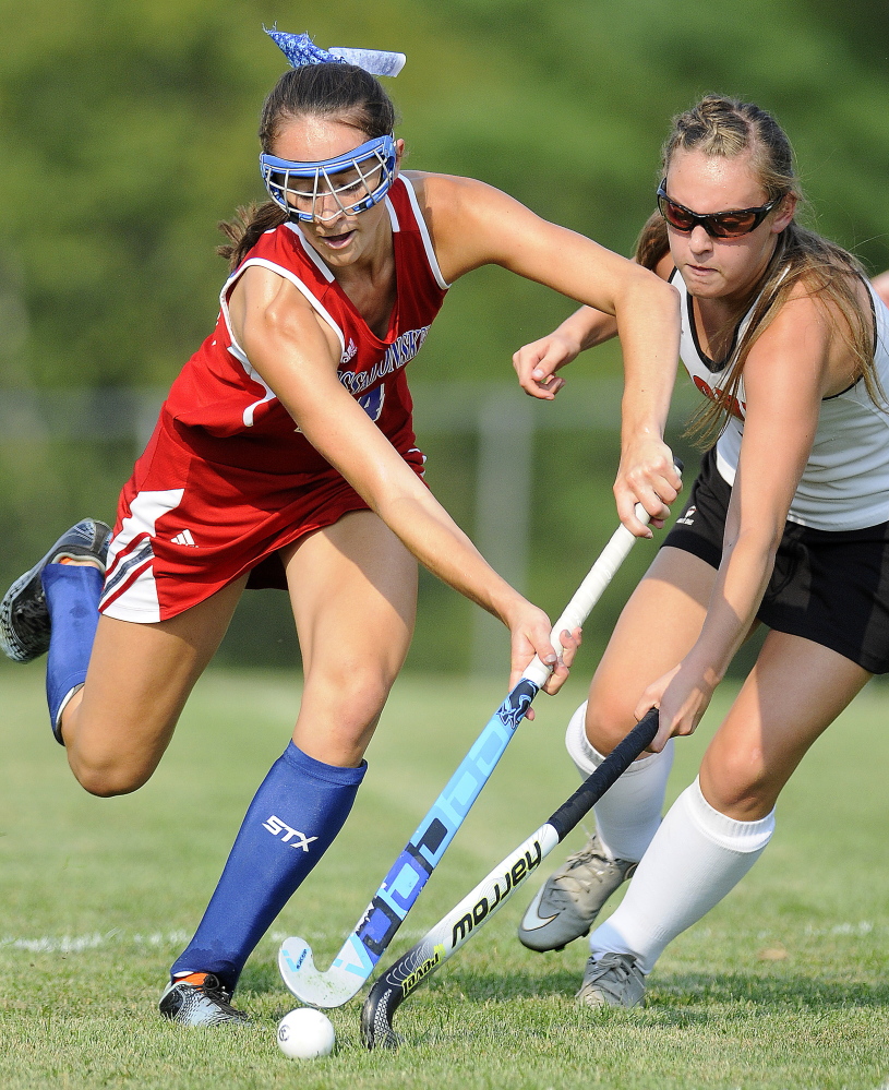Staff photo by Andy Molloy 
 Cony High School's Delaney Keithley, right, can't stop Messalonskee's Haley Lowell during a Kennebec Valley Athletic Conference Class A game Wednesday in Augusta.
