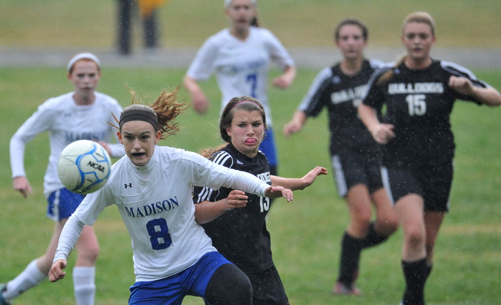 Staff file photo by Michael G. Seamans 
 Madison's Kayla Bess, front, fights for the ball with Hall-Dale defender Emma Begin during a Mountain Valley Conference game last fall. Bess will lead a formidable Bulldogs squad this season.