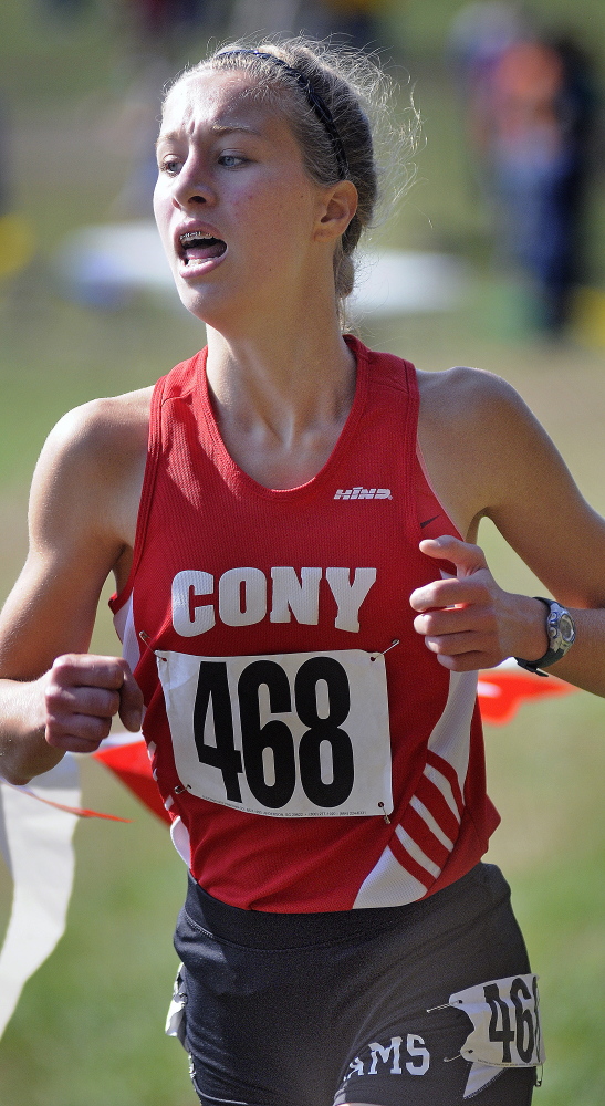 Staff file photo by Andy Molloy 
 Cony's Anne Guadalupi finishes the Kennebec Valley Athletic Conference cross country championship meet in Augusta last year. Guadalupi won the KVAC A girls race in 20 minutes, 30.6 seconds.