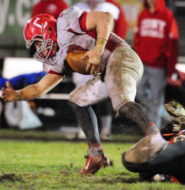 Stafff file photo by Joe Phelan
FIGHTING FOR YARDS: Cony running back Reid Shostak, left, gets tripped up by Gardiner defenders during the annual rivalry game last fall. Shostak leads a Cony team that hopes to contend in tough Pine Tree Conference Class B.