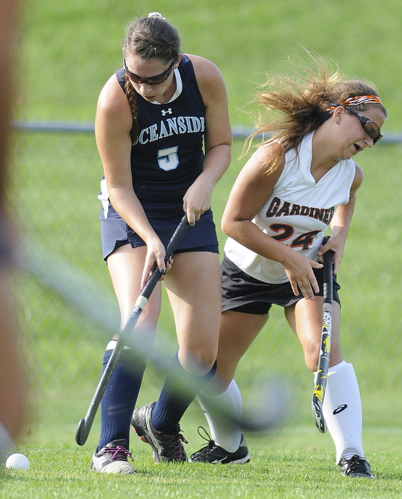 Gardiner Area High School’s Kenzie Edwards, right, bounces off Oceanside High School’s Mary Allen during a game Thursday in Gardiner.