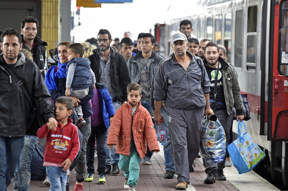 Refugees from Syria arrive at the train station  in Dortmund, Germany, on Sunday.