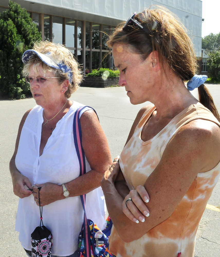 Brenda Waugh, left, an aunt of Scott Brown’s, and his grandmother Pam Mattson speak about the teenage Skowhegan Area High School student and football player on Monday outside the school. Brown died Sunday evening while swimming in Embden Pond in Embden.