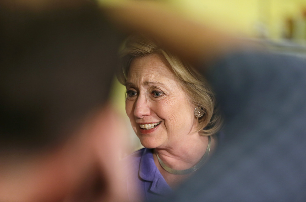 Democratic presidential candidate Hillary Rodham Clinton greets supporters during a campaign stop at Uncle Nancy’s Coffee House, Sunday, in Newton, Iowa.