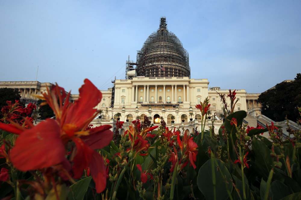 The west front of the U.S. Capitol is seen under repair, Wednesday in Washington.