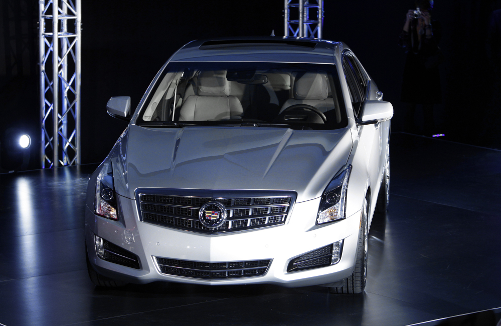 This Jan. 8, 2012 file photo shows the 2013 Cadillac ATS as it makes its debut prior to the North American International Auto Show in Detroit.  General Motors is recalling about 121,000 Cadillacs because the rear window defroster control can overheat and catch fire.