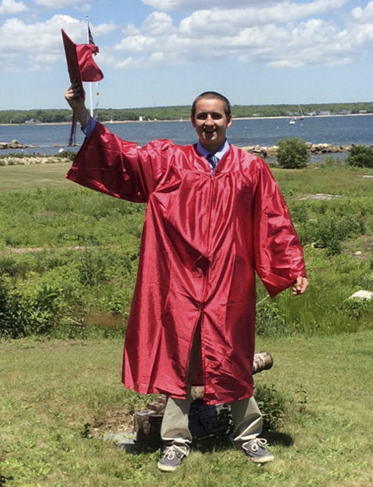In this June 7, 2014 photo provided by his grandmother Janice Roy, Conrad Roy III celebrates his high school graduation Old Rochester Regional High School in Mattapoisett, Mass.