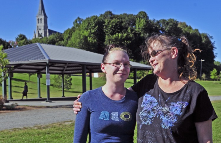 Shauna Wade, left, and her mother Jessica Ward stand together on Friday at Mill Park in Augusta, where a vigil is planned for Sunday to offer support and highlight the struggle of addiction.