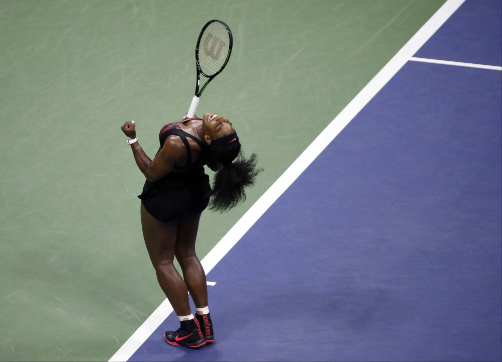 AP photo 
 Serena Williams reacts after beating sister Venus Williams during a quarterfinal match at the U.S. Open on Tuesda in New York.