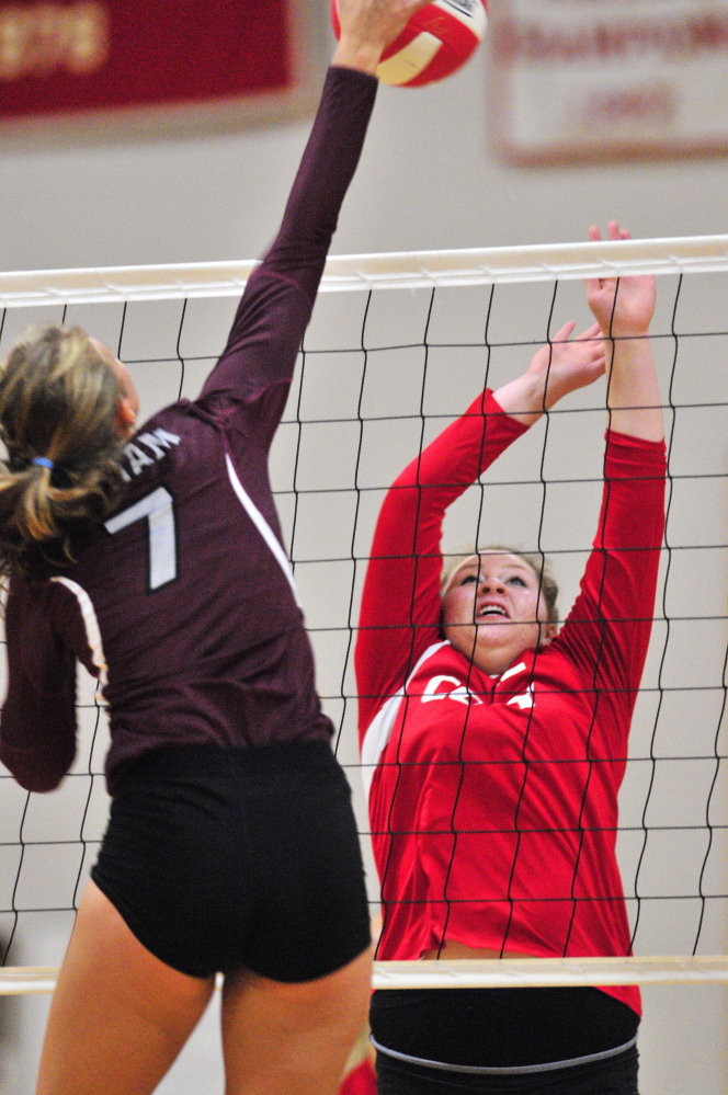 Staff photo by Joe Phelan
Gorham’s Diana Kolb, left, takes a shot that Cony’s Hannah Kibben tries to block during a game Thursday at Cony High School in Augusta.