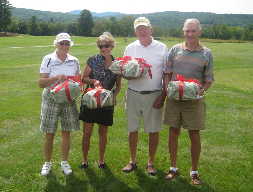 Lowest net winners, from left, are Suzanne Twitchell, Nancy Stowell, John Cureton and Dick Stowell.